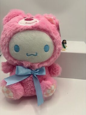 Sanrio Cinnamoroll plush toy dressed in a pink Care Bear costume